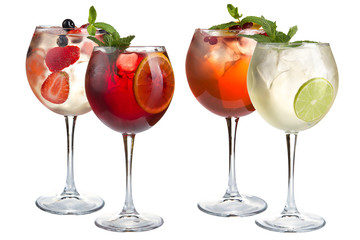 Alcohol cocktail with mint, fruits and berries on a white background. A set of four cocktails in glass glasses on a long leg.