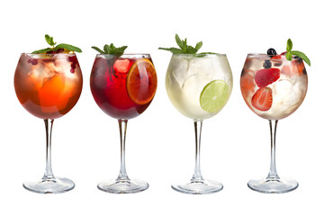 Alcohol refreshing cocktails with mint, fruits and berries on a white background. A set of four cocktails in glass glasses on a long leg.