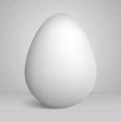 Realistic egg with a shadow on a gray background in the best traditions of minimalism.