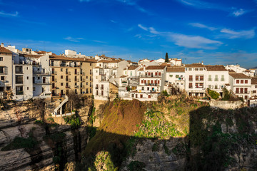 Fototapeta na wymiar Houses along the El Tajo gorge over at La Ciudad, south side of Ronda