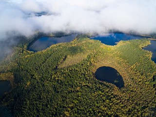 Low level clouds over beautiful landscape of Mazury region during autumn season - Kacze Lake and...