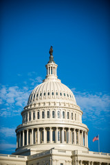 Fototapeta na wymiar Scenic blue sky view of the dome of the US Capitol Building in bright midday sun in Washington DC, USA