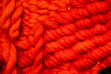 Arrière plan maille tricotée en grosse laine rouge © PicsArt