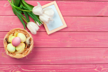 Easter background with tulips, eggs . Top view with copy space
