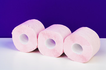Roll of toilet paper or tissue  on color background