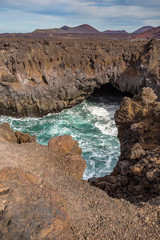Fototapeta na wymiar Los Hervideros lava's caves in Lanzarote island, popular touristic attraction, Canary islands