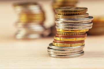 piles of coins on working table