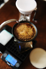 Coffee blooming in porous ceramic paperless filter. Alternative brewing. Gooseneck, electronic...