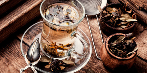 Obraz na płótnie Canvas Herbal tea on wooden table