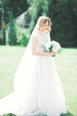 Beautiful luxury bride in elegant white dress