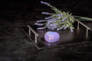 Purple heart dessert with mirror glaze. Modern European dessert on dark surface with copy space