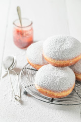 Tasty and homemade donuts with powdered sugar