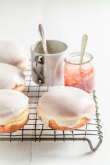 Delicious and sweet donuts with red jam