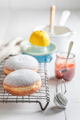 Homemade and tasty donuts with red jam