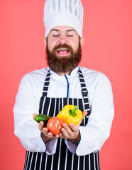 Choose vegetarian lifestyle. Man cook hat apron hold fresh vegetables. Buy fresh vegetables grocery store. Vegetarian restaurant. Hipster chief chef vegetarian cafe. Vegetarian recipe concept