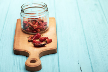 dried red pepper on a cutting board