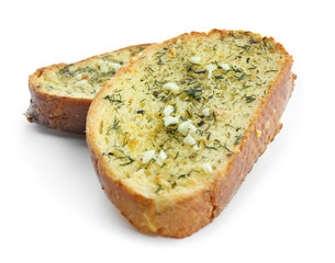 Tasty cut garlic bread on white background