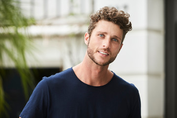 Obraz premium Handsome young man in blue, portrait