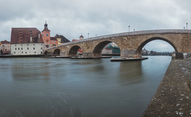 Fototapeta premium January - 2019. Panorama view from Danube and Stone Bridge in Regensburg, Germany