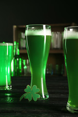 Glasses of green beer on table. Saint Patrick's Day celebration