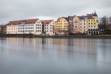 Fototapeta na wymiar Regensburg, Germany - January 2019: Architecture of Old Town of Regensburg city on the rive Danube. Long exposure.