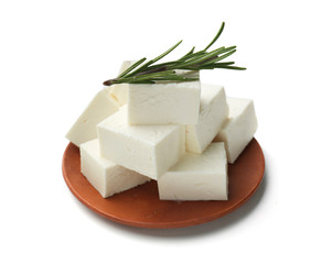 Plate with tasty feta cheese on white background