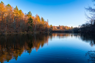 Naklejka na ściany i meble Germany, Stunning autumn colors in baerensee lake park near stuttgart