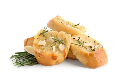 Tasty cut garlic bread on white background