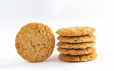 Homemade oat cookies stacked on white table background. Its are a nutrient-rich food associated with protein and fiber.