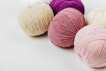 Colorful yarn for knitting on White background.