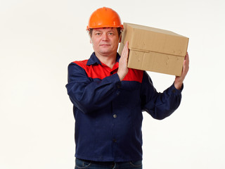 man holds in his hands a big box on a white background.