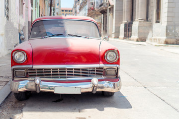 View of yellow classic vintage car in Old Havana, Cuba