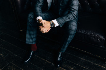 Fototapeta na wymiar Closeup fashion image of luxury watch on wrist of man.body detail of a business man.