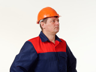 man in builder overalls on white background.