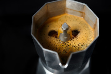 Coffee brewing. Close-up of geyser coffee maker.