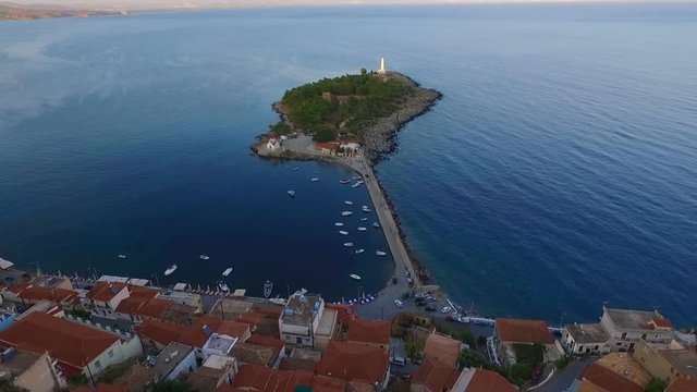 Aerial drone video of famous small islet of Kranai known for old lighthouse and tower of Tzannetakis, Gytheio, Lakonia, Peloponnese, Greece