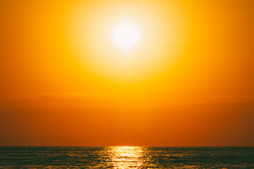 Fototapeta na wymiar summer sea landscape with orange sky at sunset