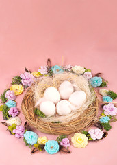 Fototapeta na wymiar Spring mood, Easter decor of eggs, paper flowers, a wreath of vines on a Living Coral background. high banner - Image.