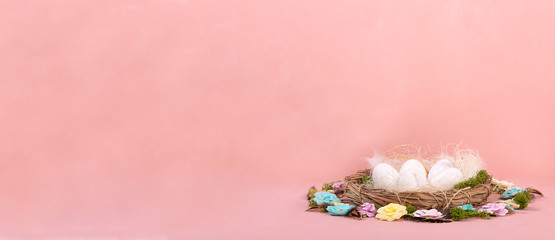 Spring mood, Easter decor of eggs, paper flowers, a wreath of vines on a Living Coral background. Wide banner - Image.