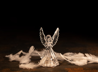 Glass angel on a dark background