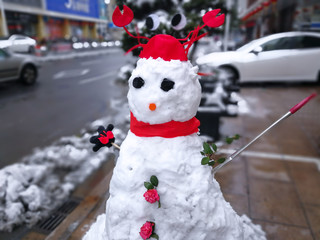 A small snowman on the snow