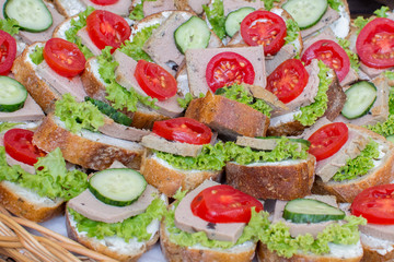 Sandwich with liver pate and fresh cucumbers, tomatoes, salad