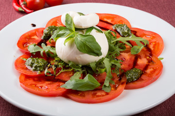 Italian burrata cheese served with sliced tomatoes