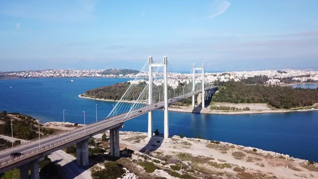 Aerial drone video of new famous public strait cable bridge of Halkida or Chalkida connecting mainland with Evoia island, Greece