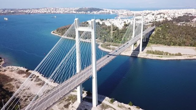 Aerial drone video of new famous public strait cable bridge of Halkida or Chalkida connecting mainland with Evoia island, Greece