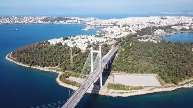 Aerial drone video of new famous public strait cable bridge of Halkida or Chalkida connecting mainland with Evoia island, Greece