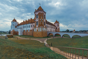 Mir Castle in Belarus cultural heritage and architecture, summer landscape with a cloudy sky