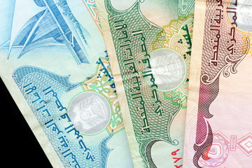 UAE dirham currency notes on a dark background close up