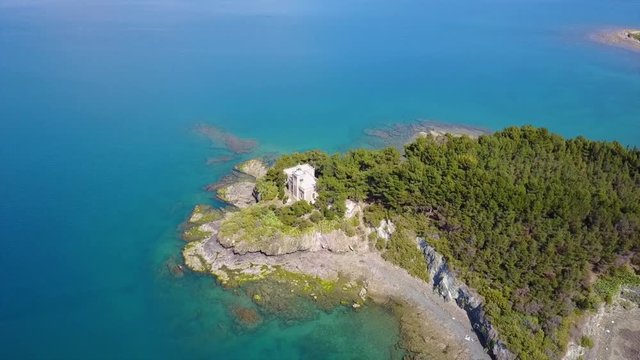 Aerial drone video of famous lighthouse built in small island and town of Halkida, Evoia island, Greece