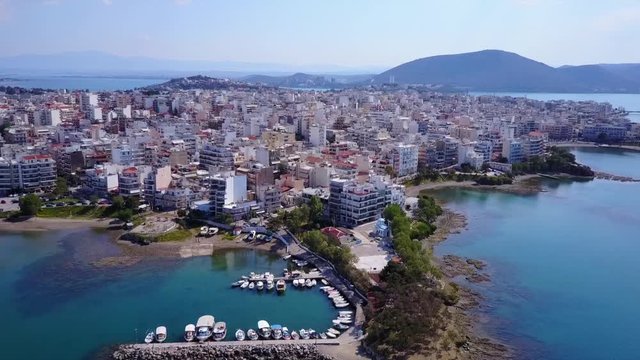 Aerial drone video of famous lighthouse built in small island and town of Halkida, Evoia island, Greece